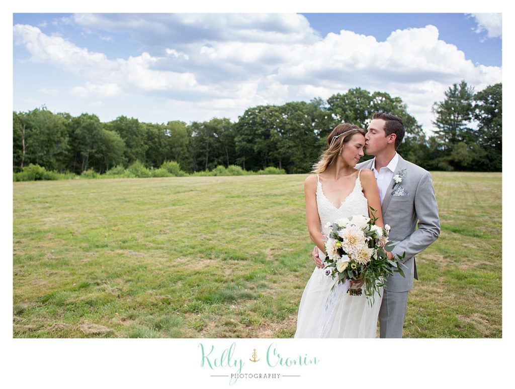 A man kisses his new wife | Kelly Cronin Photography | Cape Cod Wedding Photographer