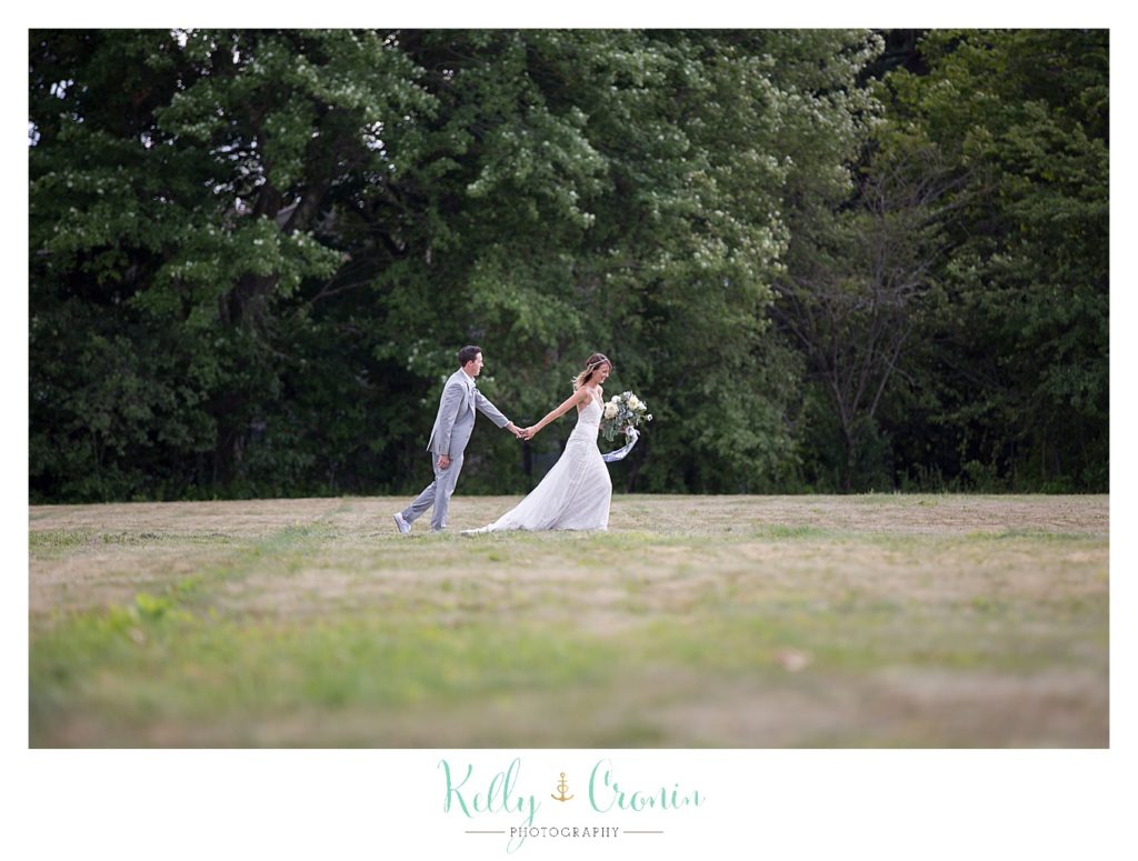 A bride leads her husband | Kelly Cronin Photography | Cape Cod Wedding Photographer