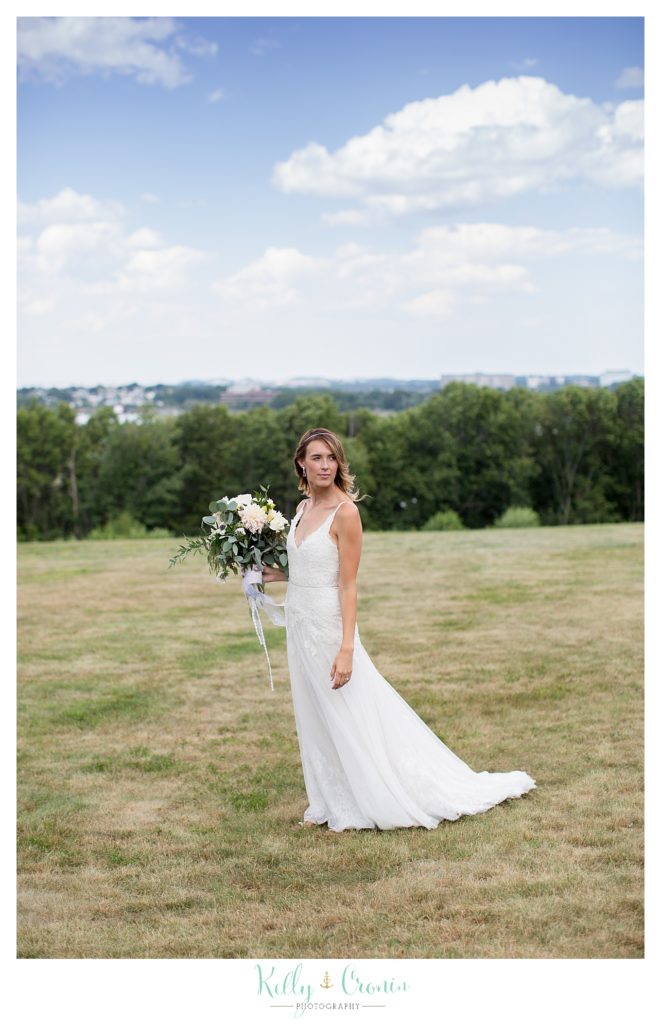 A bride holds her flowers | Kelly Cronin Photography | Cape Cod Wedding Photographer