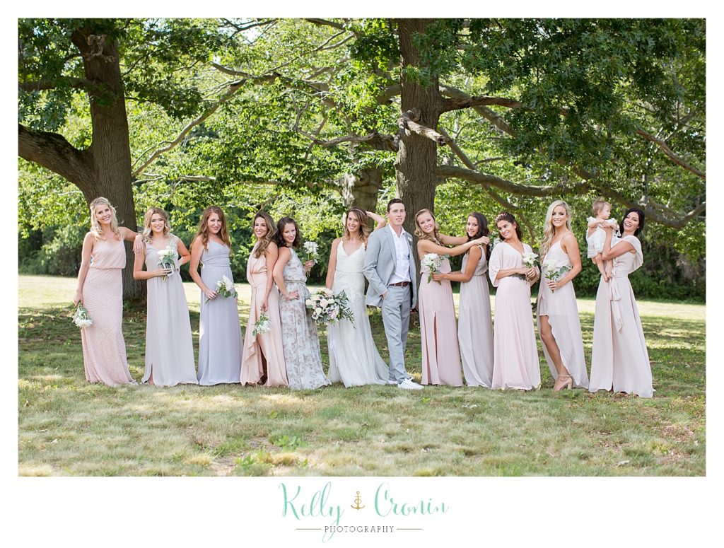 A wedding party is playful together | Kelly Cronin Photography | Cape Cod Wedding Photographer
