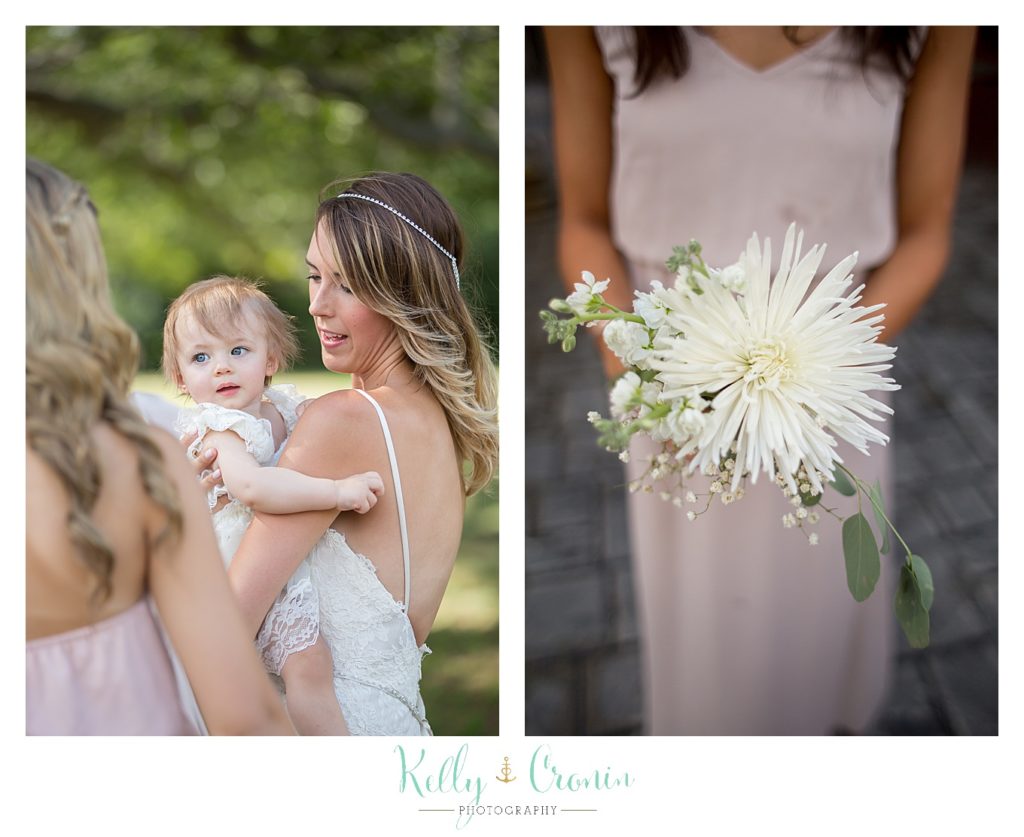 A woman holds a baby | Kelly Cronin Photography | Cape Cod Wedding Photographer