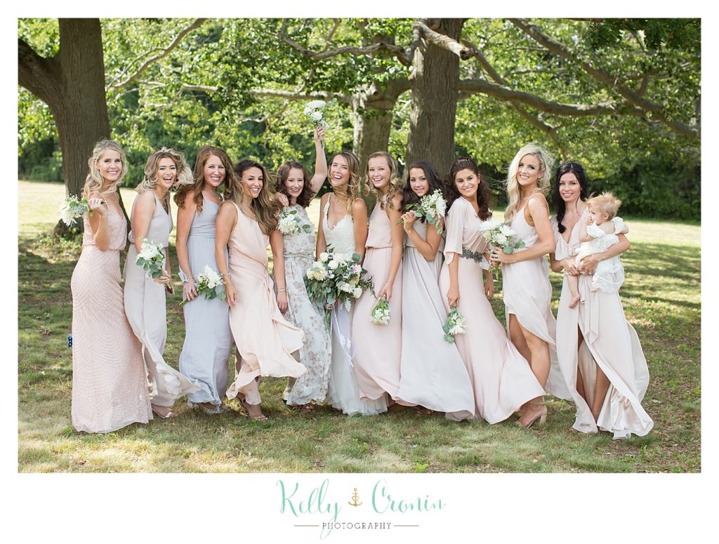 A bride and her bridal party are silly together | Kelly Cronin Photography | Cape Cod Wedding Photographer