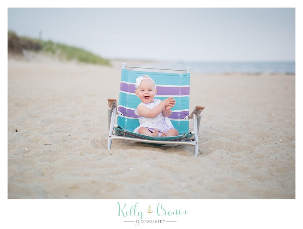 A baby sits in a chair | Kelly Cronin Photography | Cape Cod Family Photographer