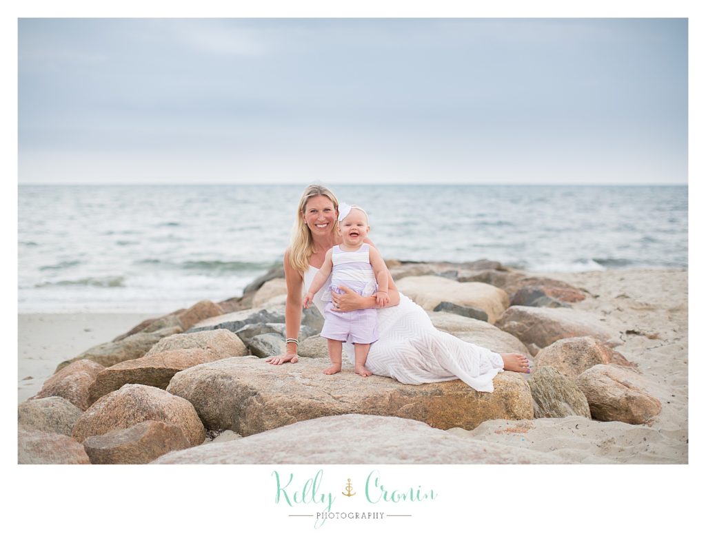 A woman holds her baby | Kelly Cronin Photography | Cape Cod Family Photographer