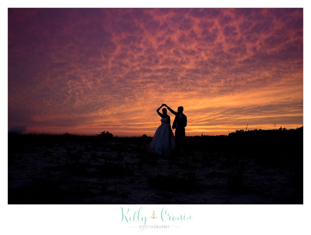 A newlywed couple dance at sunset | Kelly Cronin Photography | Cape Cod Wedding Photographer