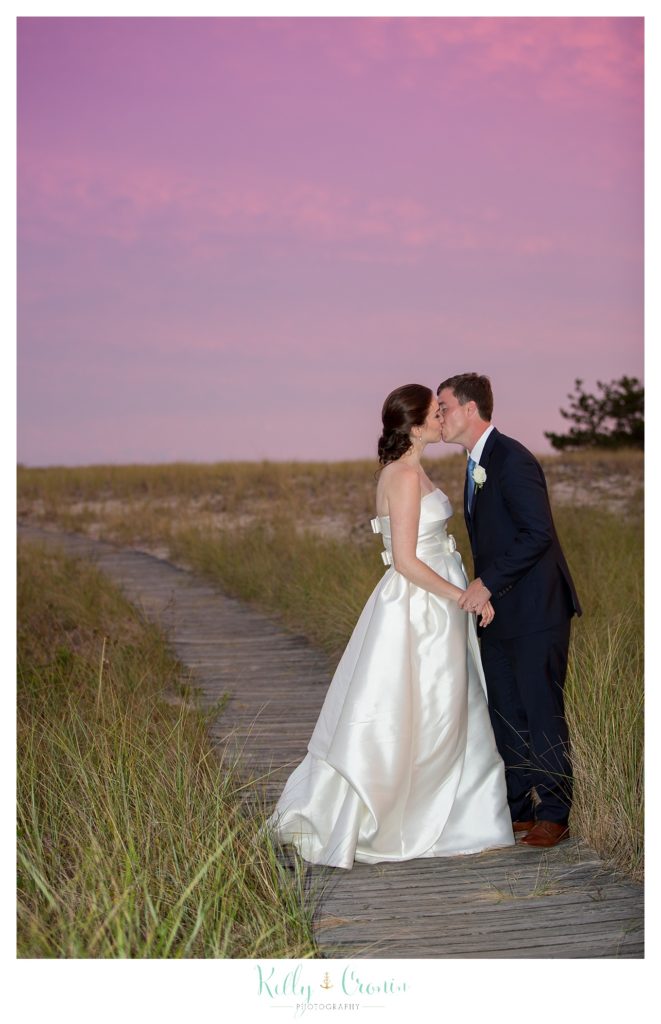 A man kisses his wife | Kelly Cronin Photography | Cape Cod Wedding Photographer