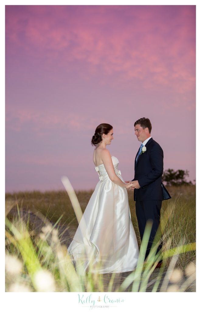 A bride looks at her groom | Kelly Cronin Photography | Cape Cod Wedding Photographer