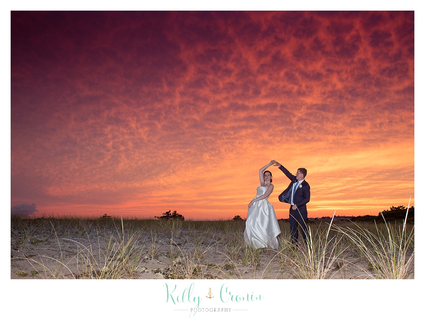 A couple dance in front of a golden sky | Kelly Cronin Photography | Cape Cod Wedding Photographer