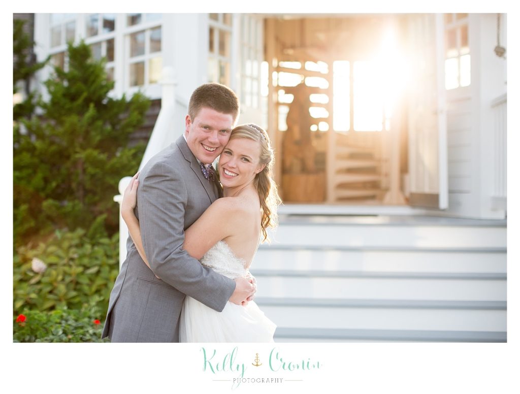 A bride hugs her groom | Kelly Cronin Photography | Cape Cod Wedding Photographer