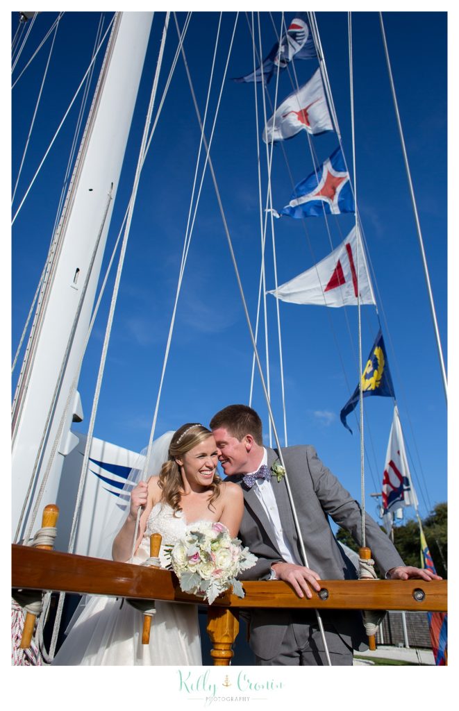 A groom whispers to his bride | Kelly Cronin Photography | Cape Cod Wedding Photographer