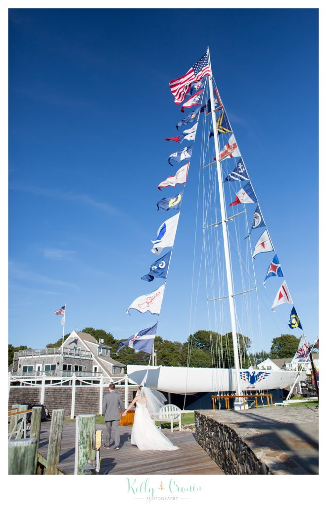 A boat has flags | Kelly Cronin Photography | Cape Cod Wedding Photographer