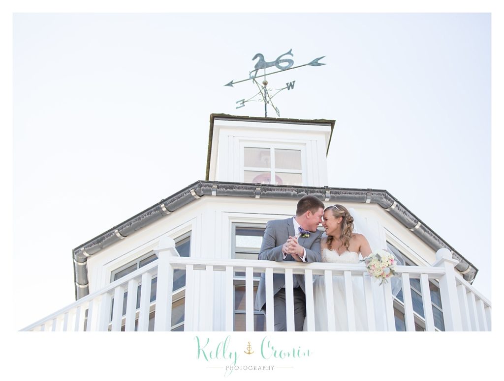 A couple kiss in a lighthouse | Kelly Cronin Photography | Cape Cod Wedding Photographer