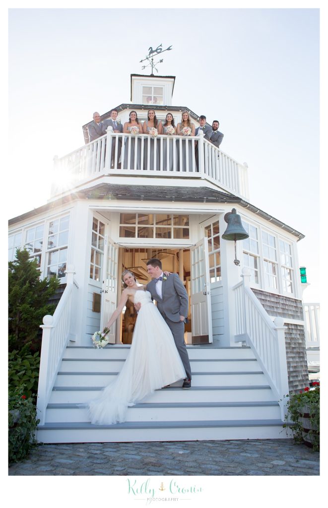 A man dips his wife | Kelly Cronin Photography | Cape Cod Wedding Photographer