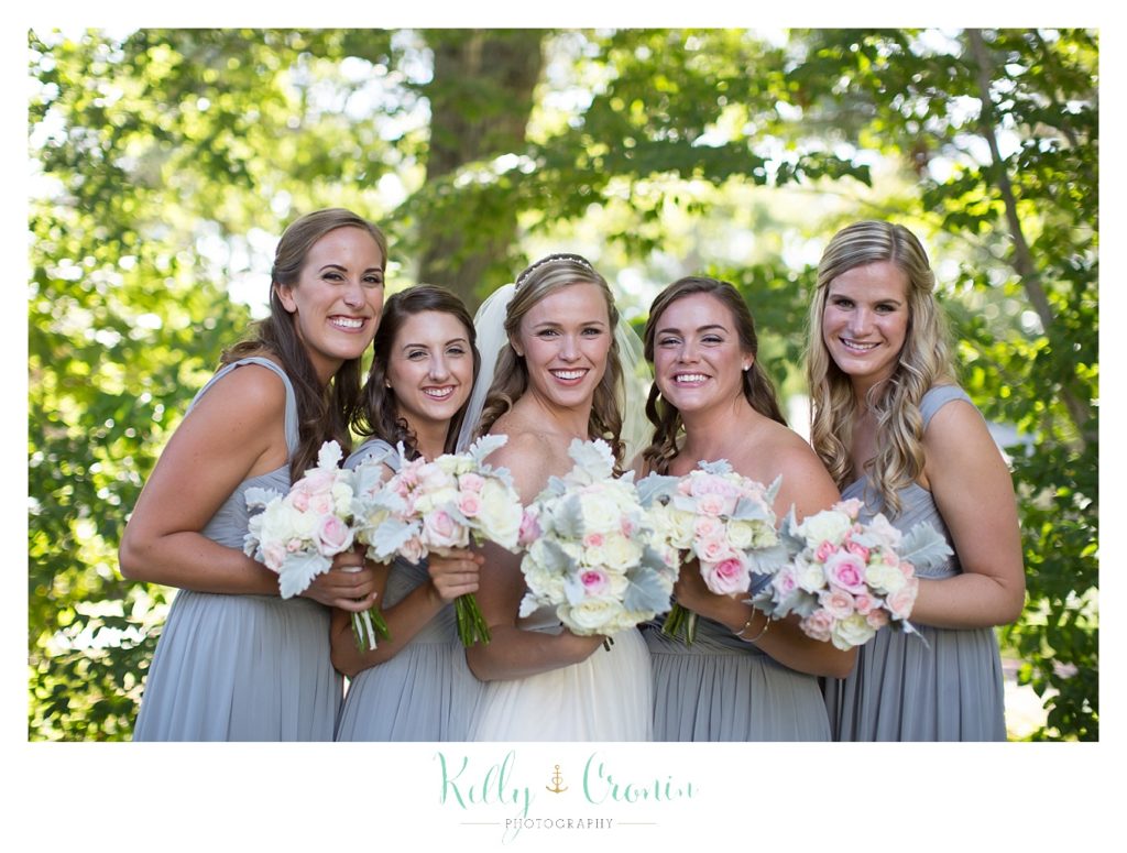 A bride poses with the bridal party | Kelly Cronin Photography | Cape Cod Wedding Photographer