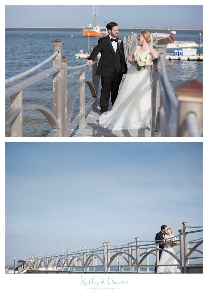 A newlywed couple walk together | Kelly Cronin Photography | Cape Cod Wedding Photographer