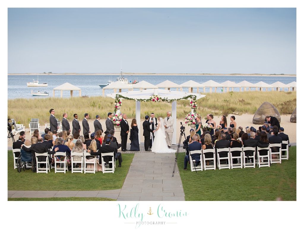 A wedding ceremony begins | Kelly Cronin Photography | Cape Cod Wedding Photographer
