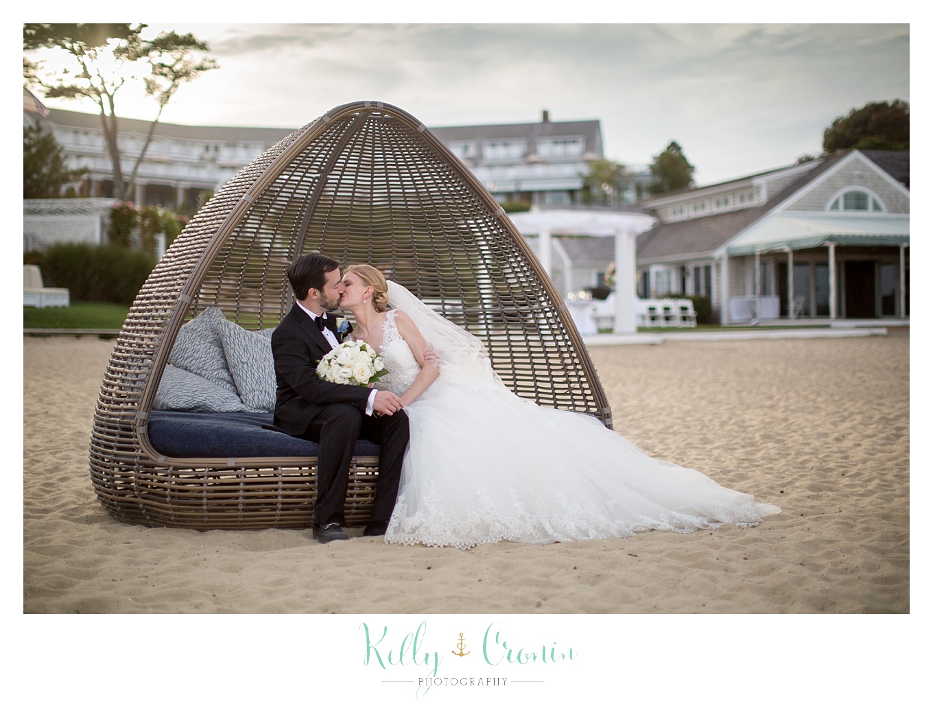 A new couple kiss in a bungalow | Kelly Cronin Photography | Cape Cod Wedding Photographer