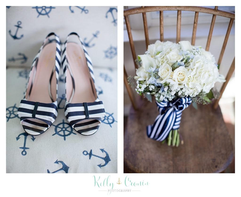 Navy and White striped bridal shoes sit on a table | Kelly Cronin Photography | Cape Cod Wedding Photographer