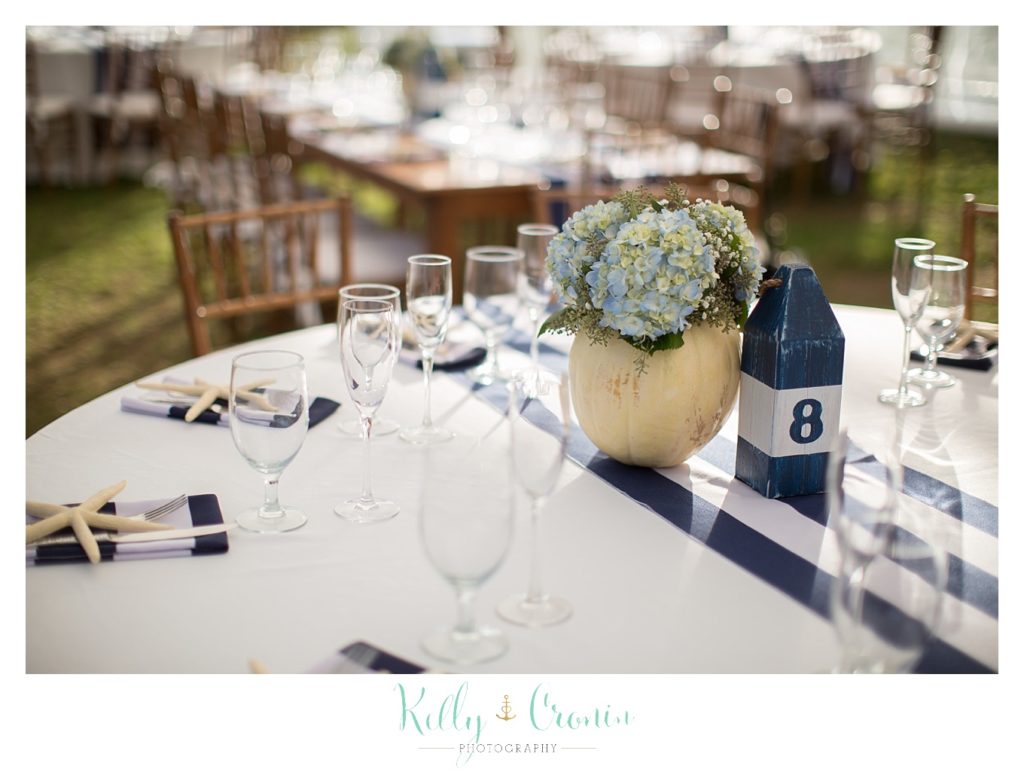A table is decorated for a wedding | Kelly Cronin Photography | Cape Cod Wedding Photographer