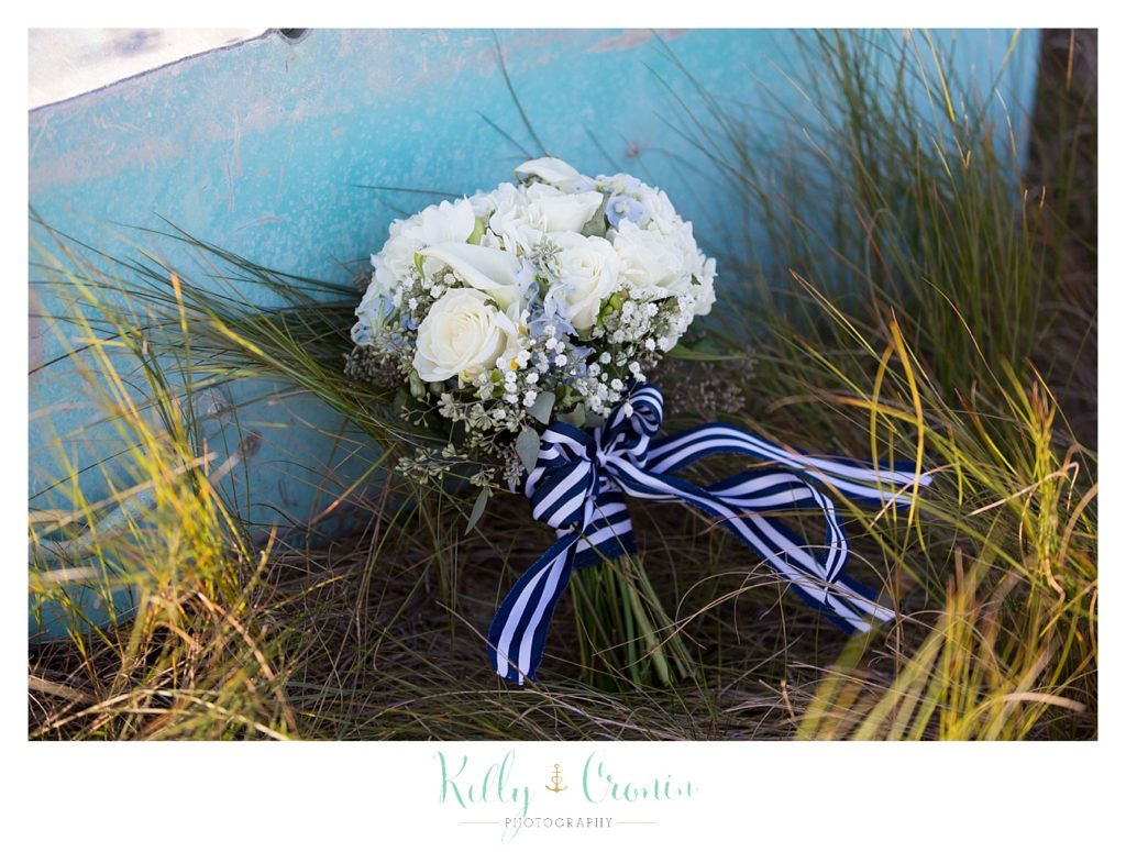 A wedding boquet sits on the ground | Kelly Cronin Photography | Cape Cod Wedding Photographer