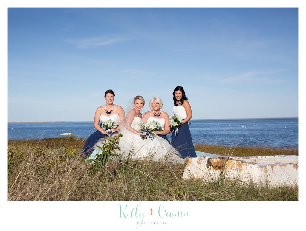 A brde sits with her bridal party | Kelly Cronin Photography | Cape Cod Wedding Photographer