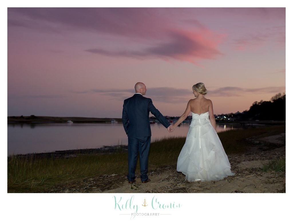 A couple walks into the sunset | Kelly Cronin Photography | Cape Cod Wedding Photographer