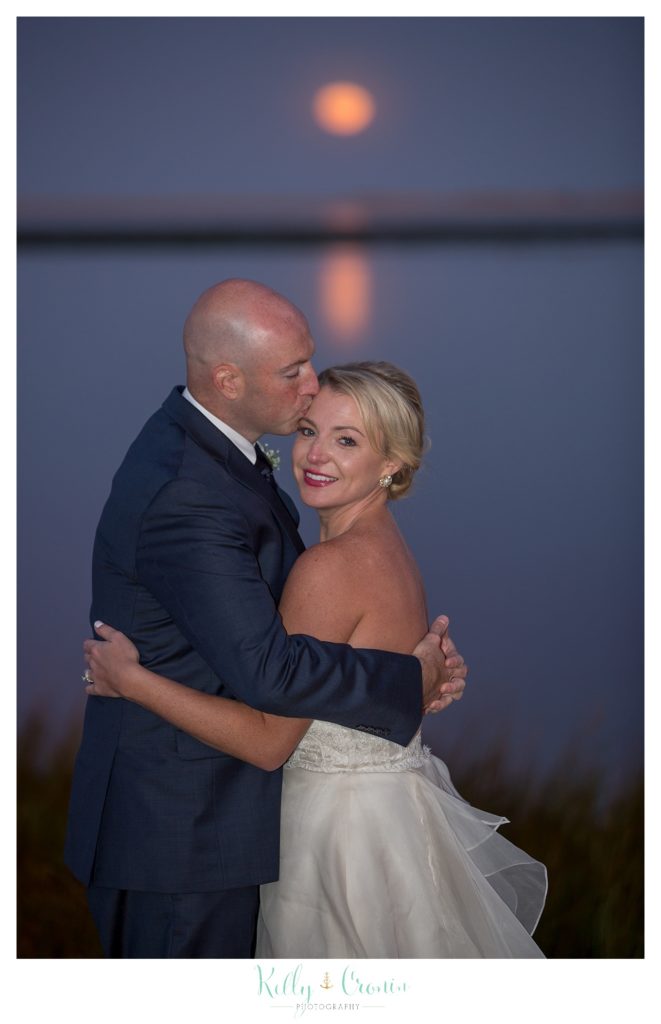 A man kisses his wife | Kelly Cronin Photography | Cape Cod Wedding Photographer