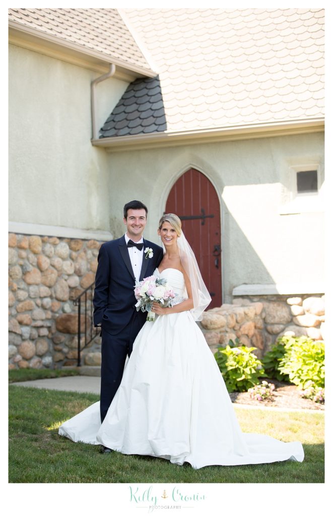 A bride and groom stand together  | Kelly Cronin Photography | Cape Cod Wedding Photographer