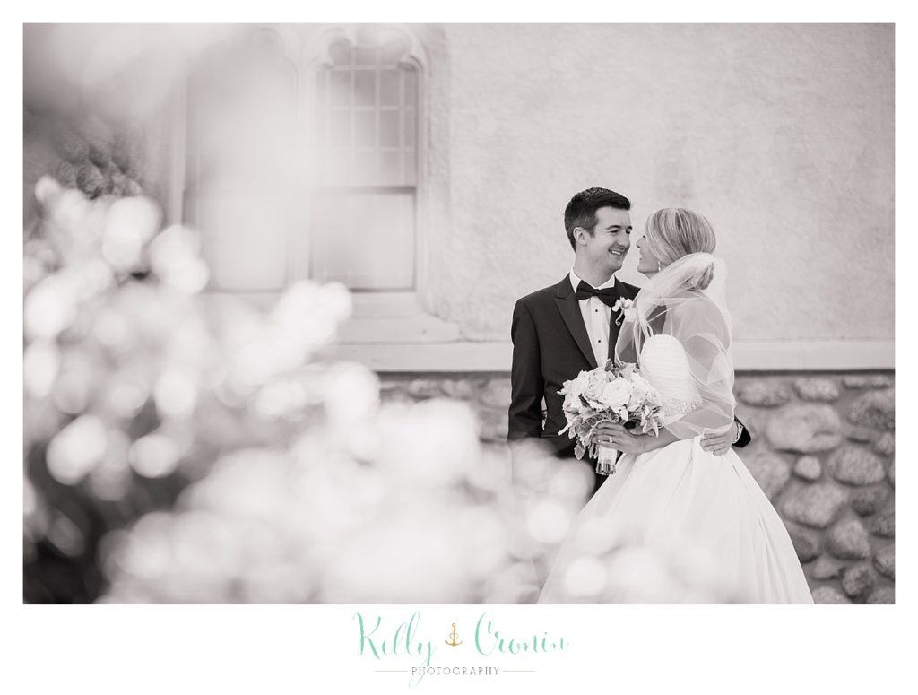 A bride and groom steal a private moment  | Kelly Cronin Photography | Cape Cod Wedding Photographer