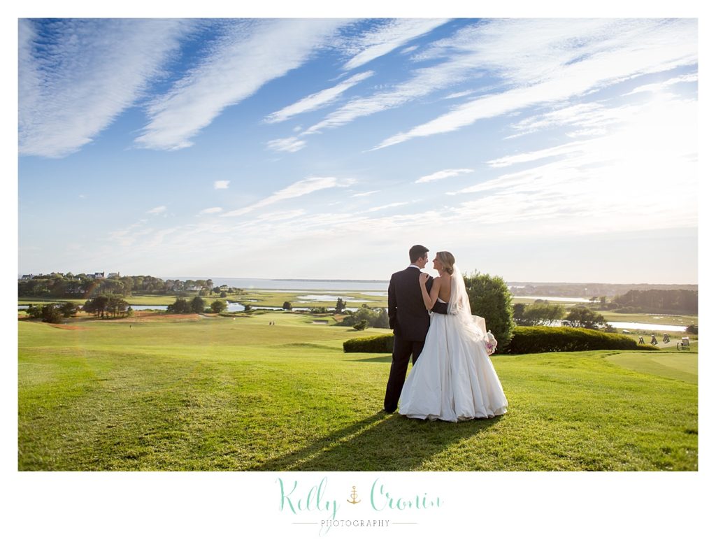 A couple gaze off into the distance  | Kelly Cronin Photography | Cape Cod Wedding Photographer