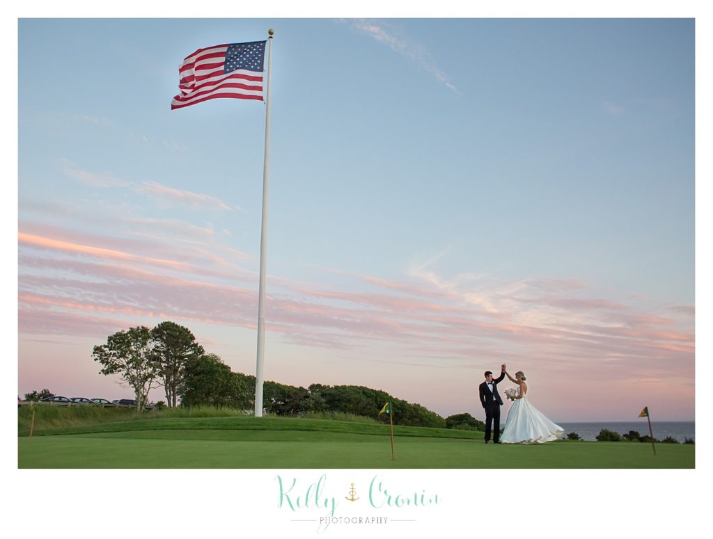 A married couple high five  | Kelly Cronin Photography | Cape Cod Wedding Photographer