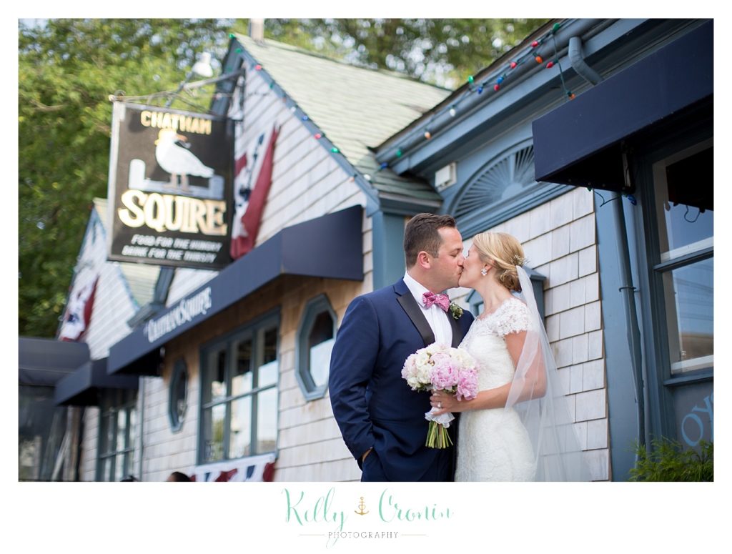 A man kisses his wife  | Kelly Cronin Photography | Cape Cod Wedding Photographer