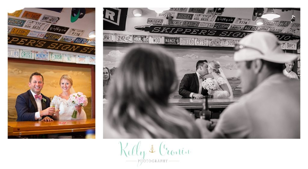 A bride and groom sit at a bar  | Kelly Cronin Photography | Cape Cod Wedding Photographer