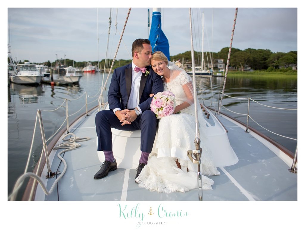 A bride and groom sail  | Kelly Cronin Photography | Cape Cod Wedding Photographer