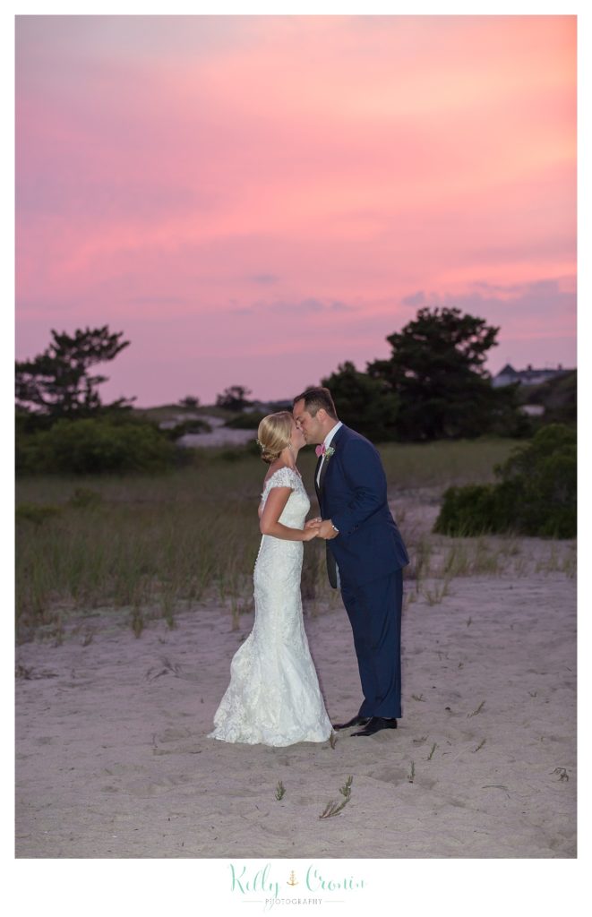 A couple kiss at sunset  | Kelly Cronin Photography | Cape Cod Wedding Photographer