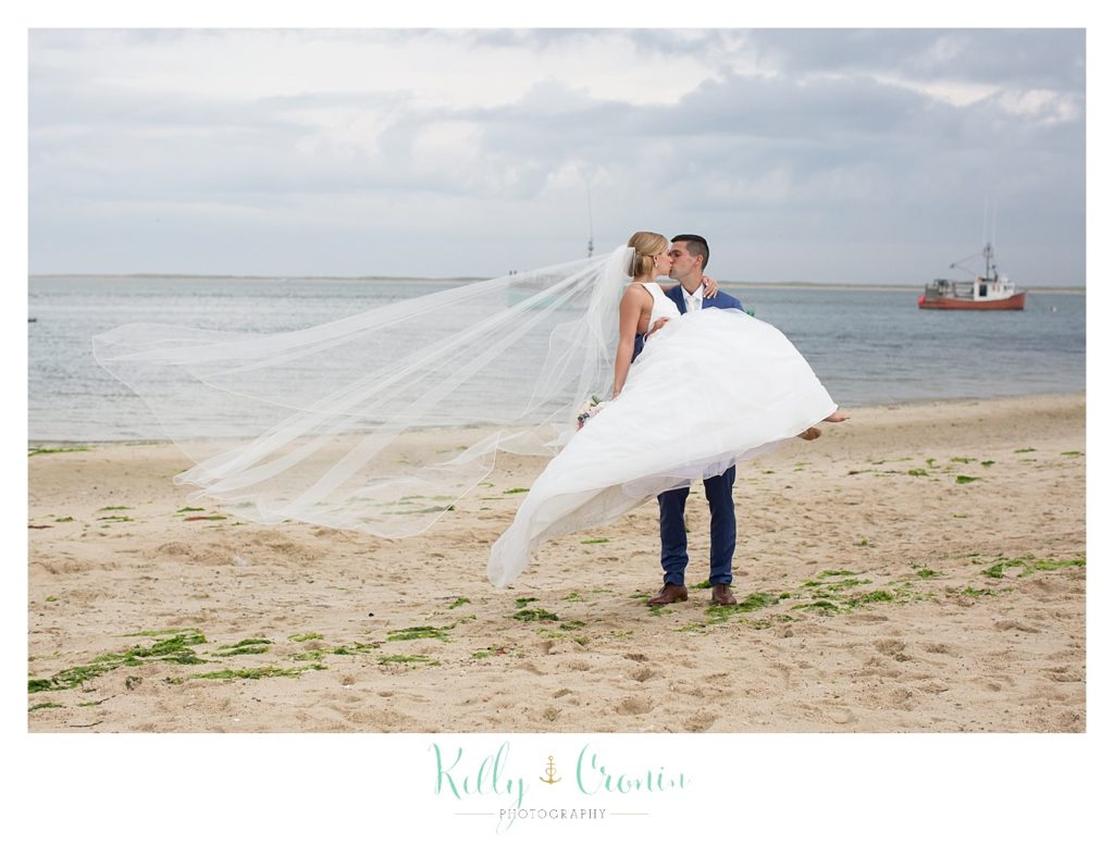 A bride kisses her groom | Kelly Cronin Photography | Cape Cod Wedding Photographer