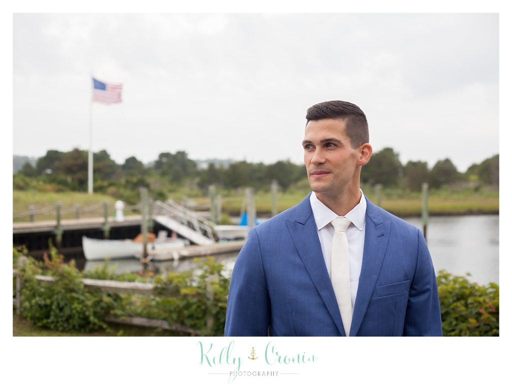 A groom looks to the side | Kelly Cronin Photography | Cape Cod Wedding Photographer