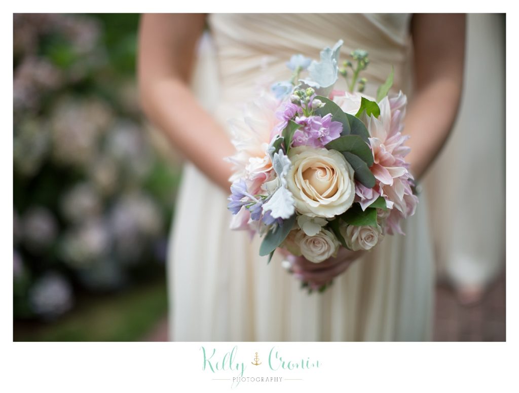 A woman holds her boquet | Kelly Cronin Photography | Cape Cod Wedding Photographer