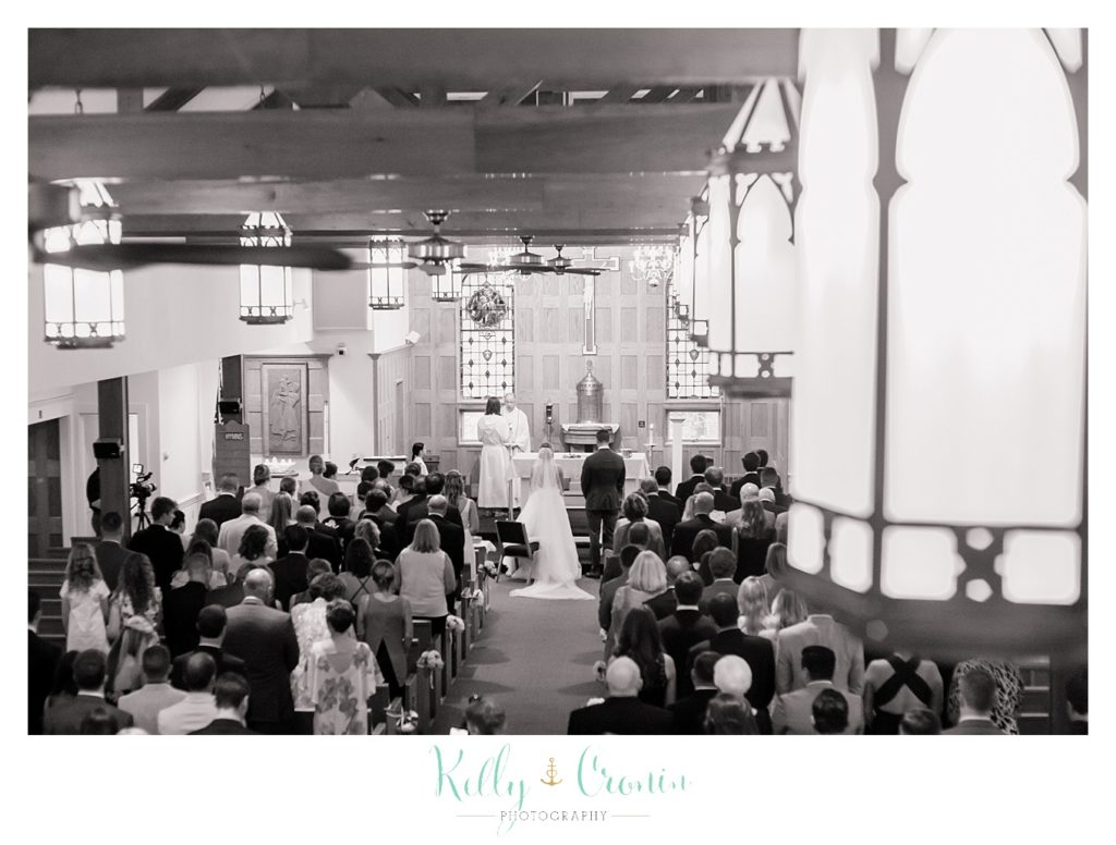 A couple stands at their wedding | Kelly Cronin Photography | Cape Cod Wedding Photographer