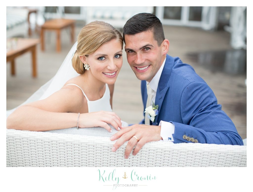 A couple sit together after they were wed | Kelly Cronin Photography | Cape Cod Wedding Photographer