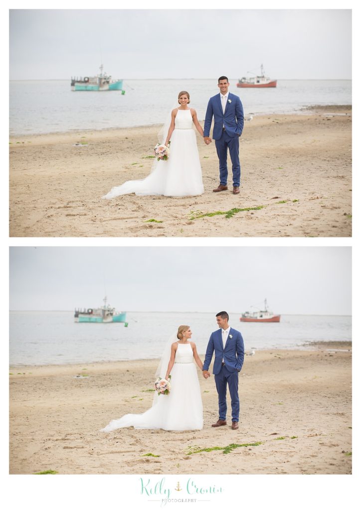 A couple stands on the beach | Kelly Cronin Photography | Cape Cod Wedding Photographer