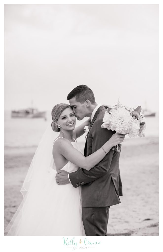 A groom gives his bride a kiss | Kelly Cronin Photography | Cape Cod Wedding Photographer