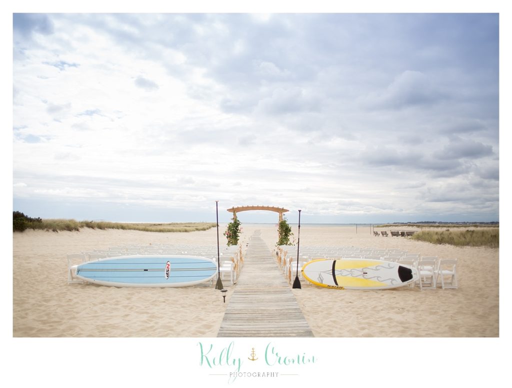 Surf boards sit next to a canopy | Kelly Cronin Photography | Cape Cod Wedding Photographer