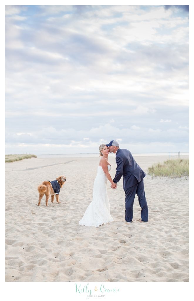 A dog watches a couple kiss | Kelly Cronin Photography | Cape Cod Wedding Photographer