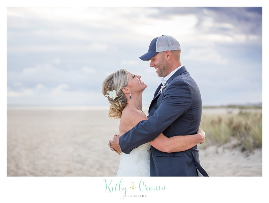 A bride looks at her groom | Kelly Cronin Photography | Cape Cod Wedding Photographer
