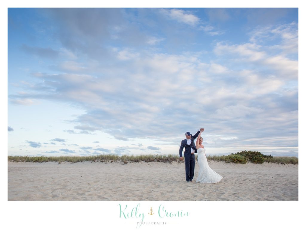 A couple walk together | Kelly Cronin Photography | Cape Cod Wedding Photographer