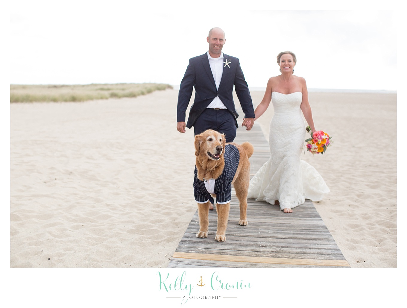 A dog leads a couple | Kelly Cronin Photography | Cape Cod Wedding Photographer