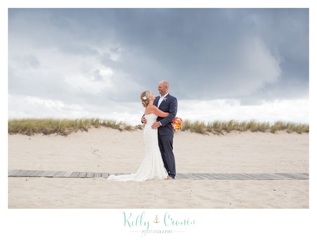 A bride and groom embrace | Kelly Cronin Photography | Cape Cod Wedding Photographer
