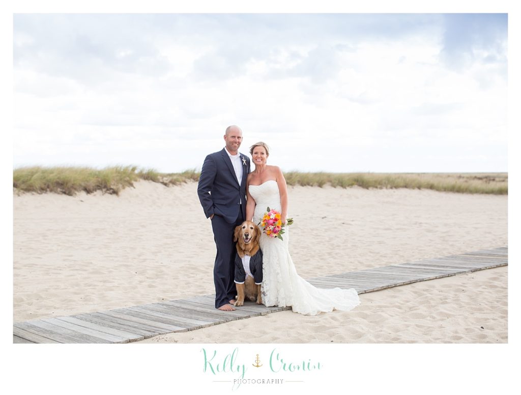 A man stands with his new wife | Kelly Cronin Photography | Cape Cod Wedding Photographer