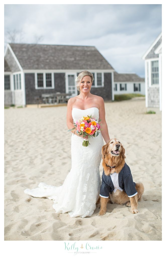 A woman stands with her dog | Kelly Cronin Photography | Cape Cod Wedding Photographer